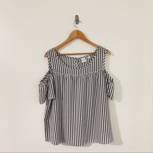 Black and white top with cut out sleeves!